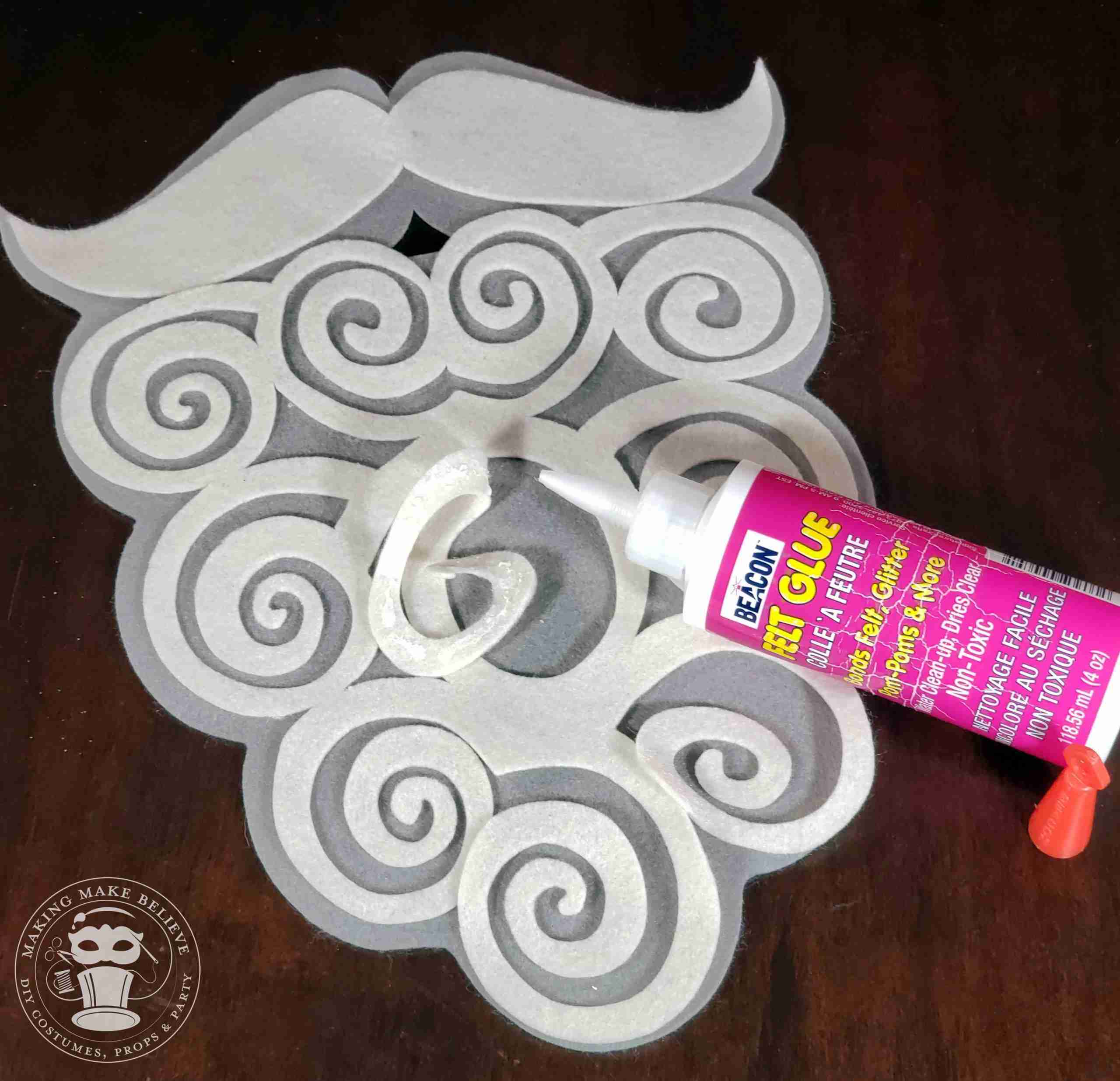 Glue overlay beard and mustache to base