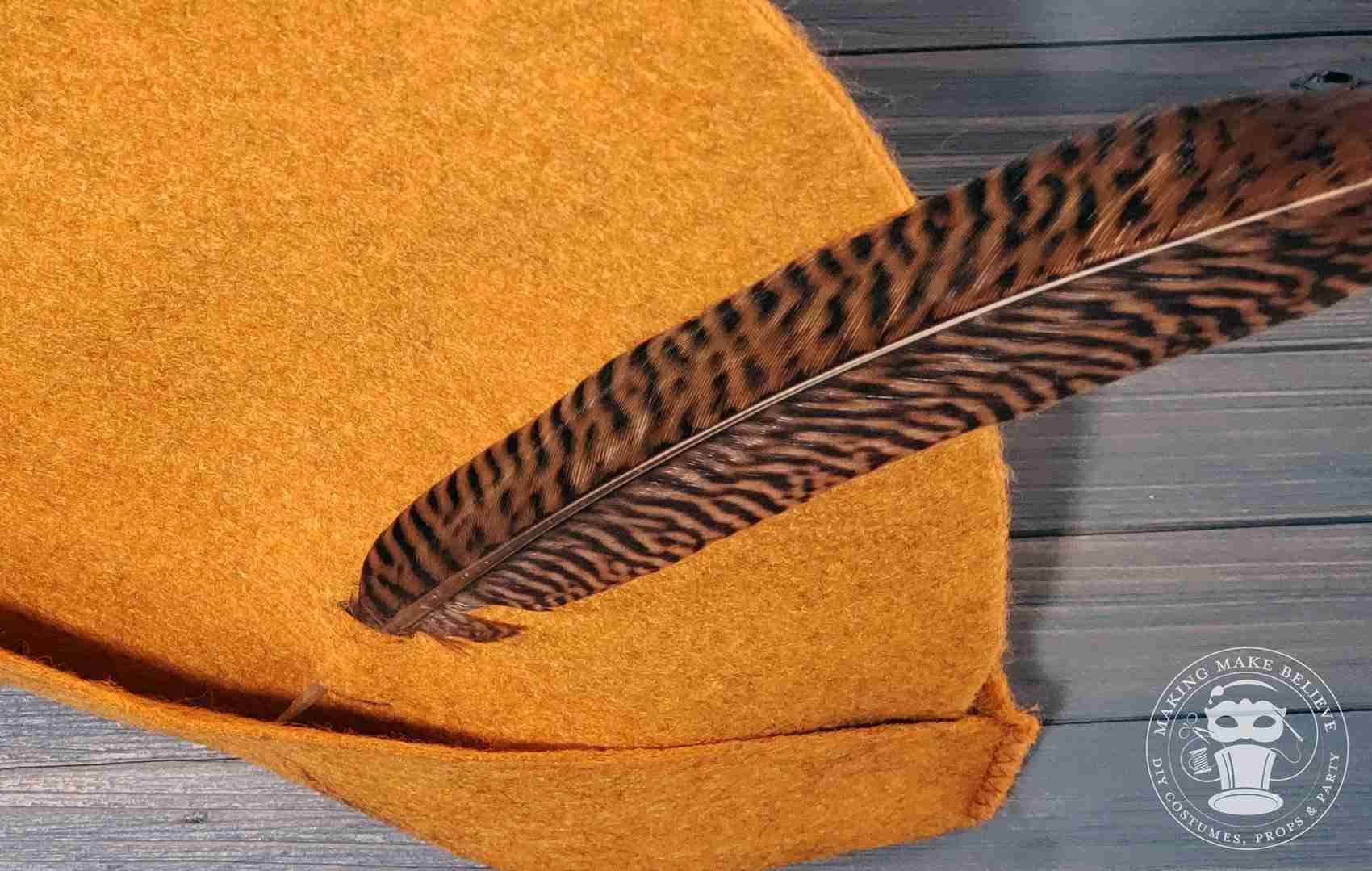 Insert feather into slits